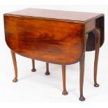 A 19thC mahogany drop leaf table, the plain rounded top raised on turned legs terminating in pad