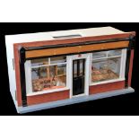 A 20thC model butcher's shop, the articulated front numbered 50, with realistic meat, some pieces