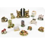 Twelve various David Winter style cottages and other buildings, book end, unmarked, 16cm high,