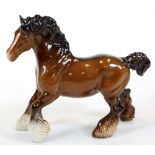 A 20thC Beswick prancing shire horse, printed marks beneath, 22cm high.