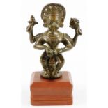 A late 18th/early 19thC South Indian Narasimha bronze figure of Vishnu, on a wooden plinth base,
