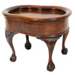 A mahogany Chippendale design bidet, of shaped form with hinged lid, shallow well and heavily carved