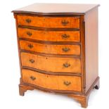 A 20thC walnut serpentine chest, the with a wide crossbanding raised above five graduated drawers,