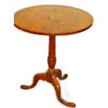 A 19thC mahogany occasional table, with plain circular top on gun barrel support terminating in