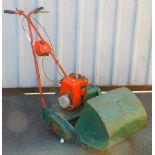 A petrol driven lawn mower with grass box, 100cm high.