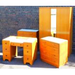 A matched four piece bedroom suite, to include dressing table 95cm wide, two door wardrobe and two