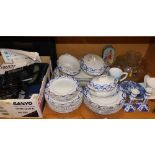 A ribbon decorated part service, Olympus and other cameras, blue and white candlesticks,