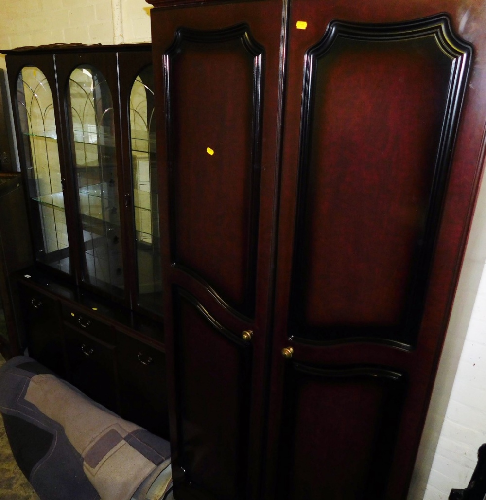 A room unit with three sections to the top, raised above a central drawer and pull door cupboard,