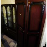 A room unit with three sections to the top, raised above a central drawer and pull door cupboard,