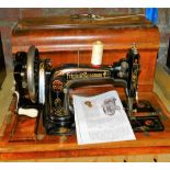 An early 20thC Frister sewing machine in wooden case, 50cm wide.