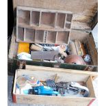 Various tools, drill bits, crank shafts, etc. and a rectangular metal trunk with studded outline,