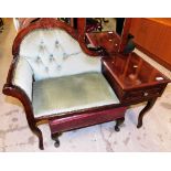 A mahogany finish telephone table, with overstuffed back, arm and seat, 34cm wide and a