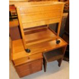 An oak sewing cabinet on wheels and a Nathan style teak single desk, 93cm wide.