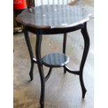 An Edwardian window table with pie crust top raised on serpentine legs joined by an under tier, 73cm