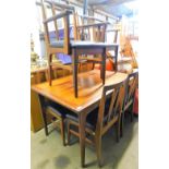 A vintage G Plan teak dining room suite, comprising rectangular table on turned legs, with a two