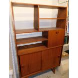 A vintage teak open display cabinet, with sliding drawers beneath, on shaped legs, 172cm high.