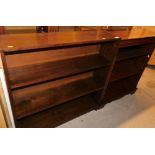 A oak open bookcase and a mahogany finish open bookcase with a wide crossbanding on bracket feet,