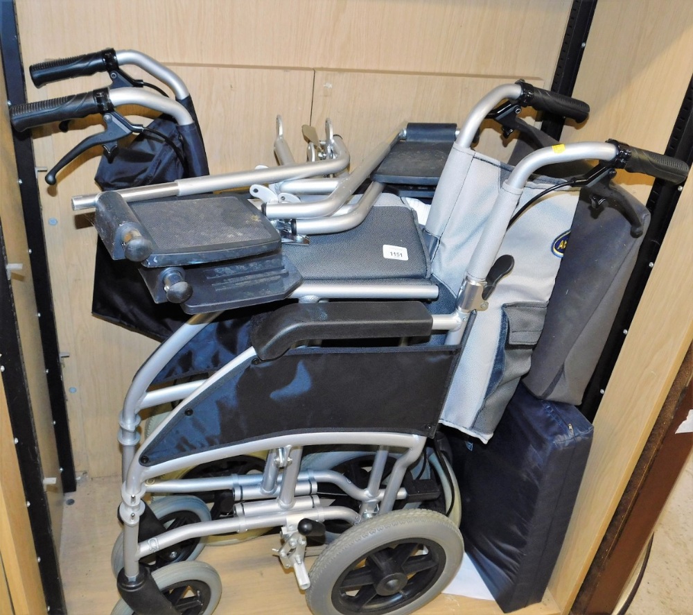 A folding wheelchair and another, 93cm high.