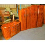 A mid 20thC three piece walnut bedroom suite, comprising double door wardrobe, another smaller and a