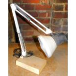 A metal angle poise lamp, on rectangular base, 20cm wide.