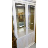 A modern display cabinet, with glazed doors, 100cm wide.