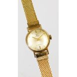 A ladies manual wind wristwatch, with baton numerals and pointers with a mesh work bracelet.