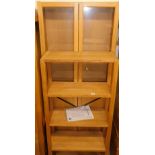 A JYSK Salkeborg bookcase, 71cm wide and a further glazed bookcase.