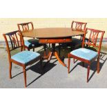 A mahogany finish dining room suite, comprising a small drop leaf table and four chairs, table