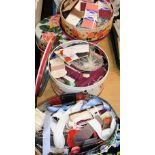 Various decorative tins containing a quantity of sewing items, vintage cotton, threads, etc. (a