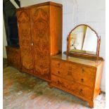 A walnut three piece bedroom suite, comprising two door wardrobe, mirror back dressing chest of