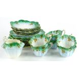 A Foley China part tea service, with shaped cups, saucers, etc., in blue and green embellished