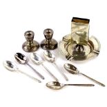 A collection of small silver, to include a pair of dwarf candlesticks, an ashtray and match
