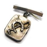 A silver horse related pendant/brooch, the small rectangular silver locket with horseshoe and riding