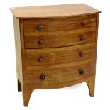 A mid 19thC mahogany bow fronted commode chest, the hinged lid enclosing a recess, the front with