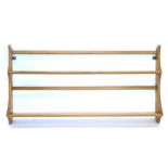 An Ercol elm two tier plate rack, 97cm wide.