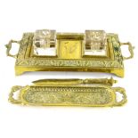 A late 19thC brass inkwell, the inkstand with two glass wells, lacking covers, and a similar