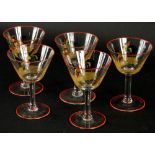 A set of five 1920's/30's cocktail glasses, each decorated with cock fighting scenes.