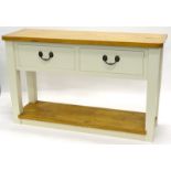 An ash and cream painted dresser base, the rectangular top with rounded cornice to front, above