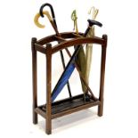An oak three division umbrella stand, and some umbrellas, etc. Provenance: The Estate of Miss Rachel