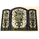 An unusual stained glass and leaded small table screen, decorated with vases of flowers etc., 72cm x