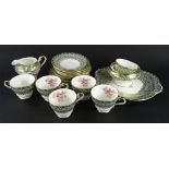 An Aynsley porcelain tea service, decorated with single of a rose picked out in gilt, to include six