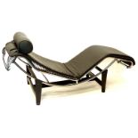 A Le Corbusier style black leather chaise longue or couch, with chromed metal frame and ebonised