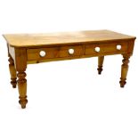 A Victorian pine diary type table, with a planked top, with canted corners, with two frieze drawers,