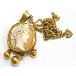 A late 19thC cameo pendant and chain, the oval cameo with figure of a maiden looking right, within