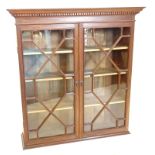 A 19thC mahogany bookcase top, with a moulded and dentil cornice, two astragal glazed doors