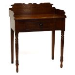 A 19thC oak washstand, with a shaped raised back, frieze drawer on turned tapering legs, 76cm wide.