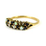 A 9ct gold dress ring, set with blue stones and imitation opals (some missing), in claw setting,