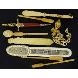 A collection of early 20thC items, to include a pierced and carved ivory page turner, an ivory