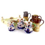 A graduated set of three Allertons lustre Masons type jugs, three Doulton stoneware jugs and a