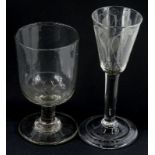 An 18thC wine glass, with tapering bowl, engraved with wheat ears etc., a plain column and fold over